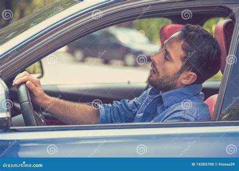 Sleepy Tired Fatigued Exhausted Man Driving Car In Traffic After Long