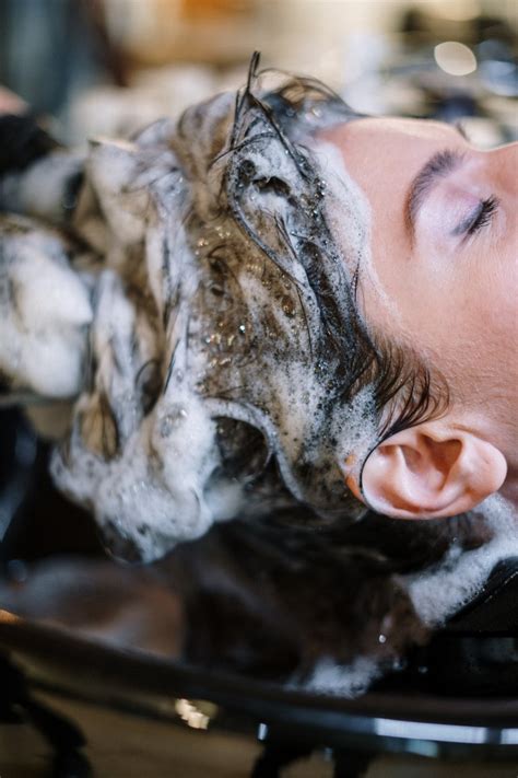 common hair washing mistakes   hair frizzy flat  damaged