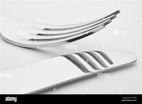 Knife And Fork Detail Over A White Background Cutlery Horizontal