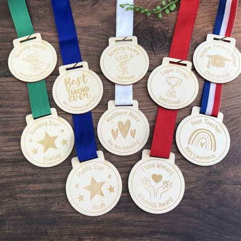 Six Medals With Ribbons Around Them On A Table