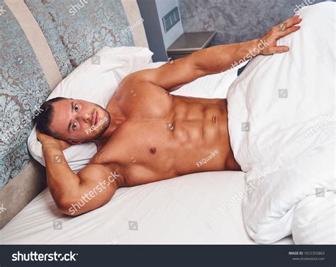 Handsome Nude Man Lying Bed Stock Photo 1012355863 Shutterstock