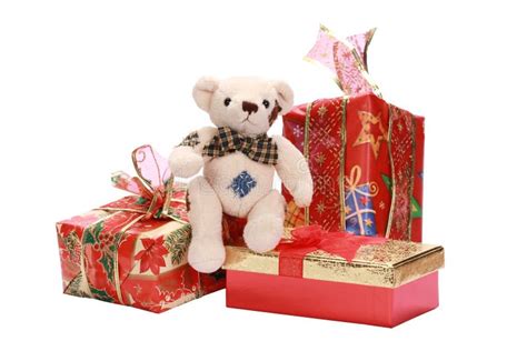 Bunch Of Beautifully Wrapped Christmas Ts With A Cute Teddy Bear