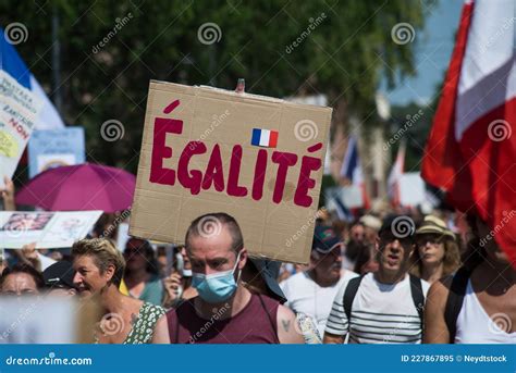 People Protesting In The Street Against The Sanitary Pass With Banner