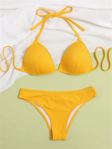 Elizabeth Hurley Shows Off Her Enviable Physique In A Yellow Bikini As She Rolls Around In The