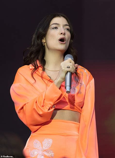 Lorde Flashes Her Toned Midriff In A Bejewelled Orange Co Ord For Radio