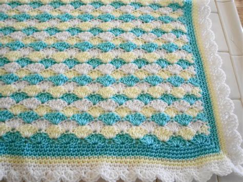 Crocheted baby blanket in shell pattern aqua blue yellow white with ...