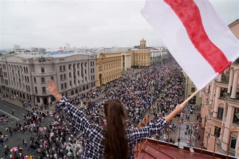 Video shows armed Belarus president as capital sees massive protests ...