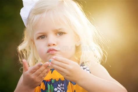 Blonde Year Old Girl Looks At The Smartphone Stock Photo Image Of