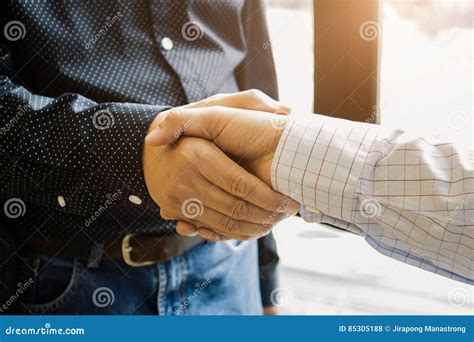 Two Cheerful Businessman Handshaking In Office Stock Photo Image Of