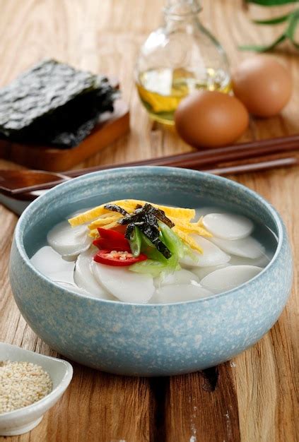 Premium Photo | Tteokguk Korean Sliced Rice Cake Soup Oval Shaped Rice ...