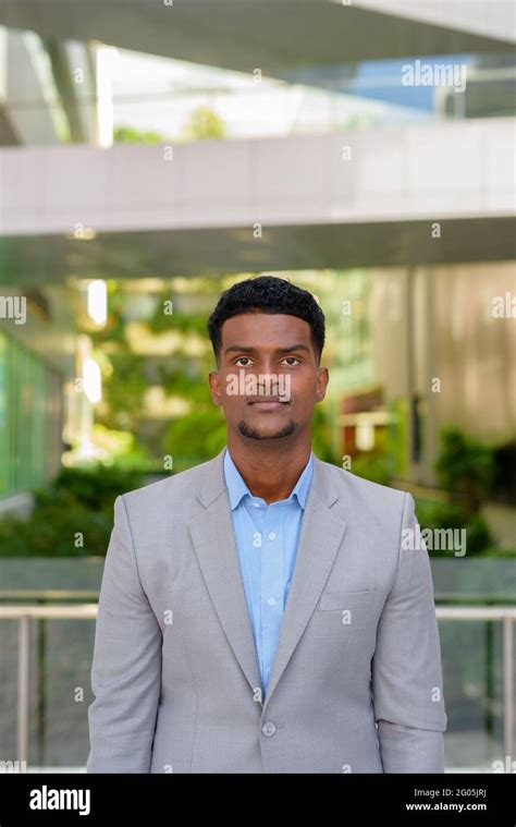 Portrait Of Handsome Young African Businessman Wearing Suit Stock Photo