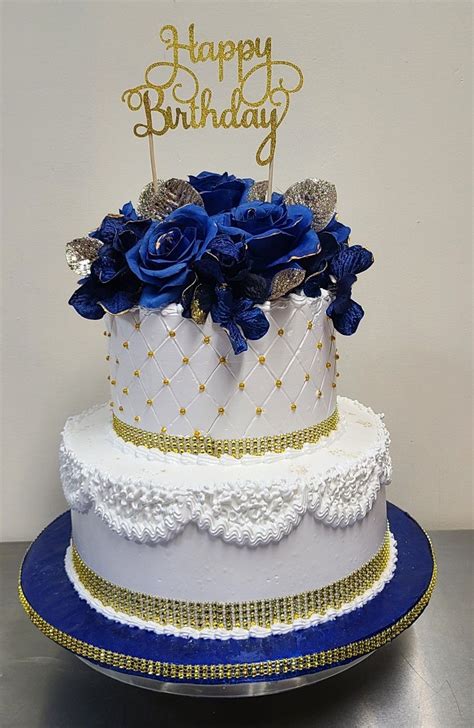 Royal Blue And White Birthday Cake With Gold Decorations