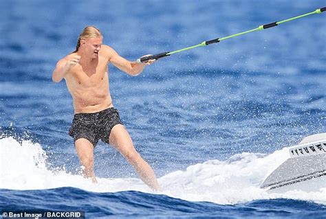 Erling Haaland Gets A Helping Hand With His Plait From His Bikini Clad