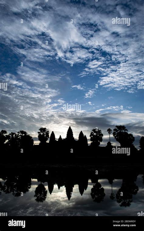 Sunrise over Angkor Wat with lake reflection Stock Photo - Alamy