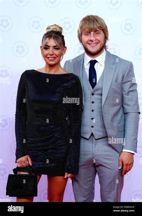 Paddy Pimblett (right) and Laura Pimblett arrive for the 2023 PFA ...