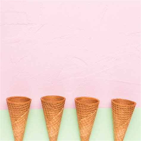 Free Photo Row Of Empty Ice Cream Cones On Multicolored Surface