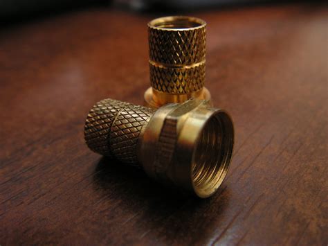 Brass Connectors on Wooden Surface Free Stock Photo | FreeImages