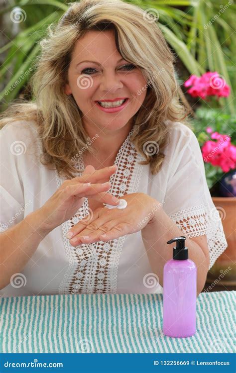 Mature Woman Applying Cream On Her Hand Stock Image Image Of Health