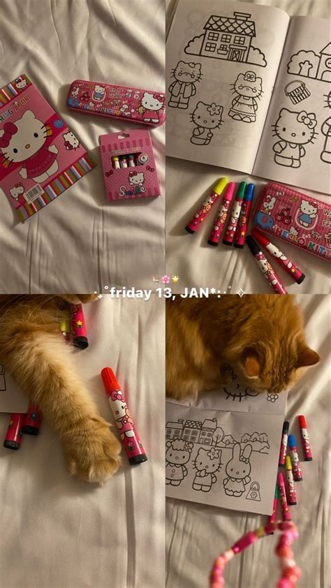 A Cat Laying On Top Of A Bed Next To Some Crayons