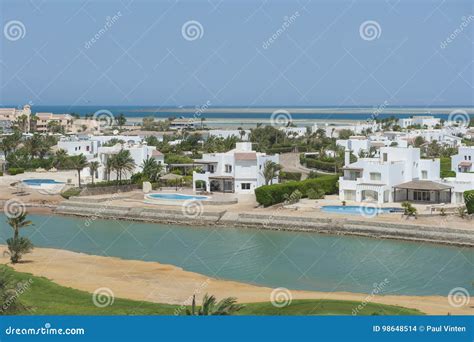 Aerial View Of Luxury Waterfront Holiday Villas On Coast Stock Photo