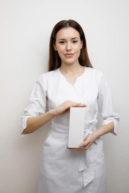 Premium Photo Doctor Woman Holding Up Small Box