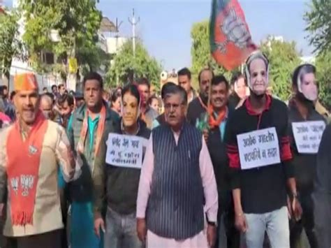 Rajasthan Bjp Stages Unique Protest In Udaipur Wearing Masks Of