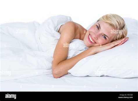 Smiling Blonde Woman Lying In Her Bed Stock Photo Alamy