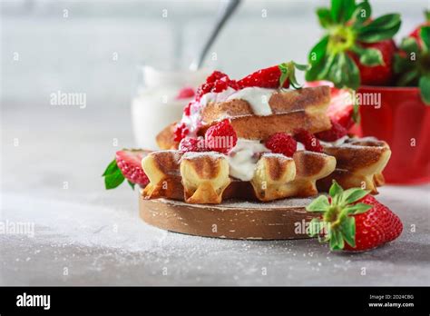 Belgian Waffles With Creem And Raspberries And Strawberries Stock Photo