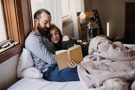 Couple Reading In Bed Hot Sale