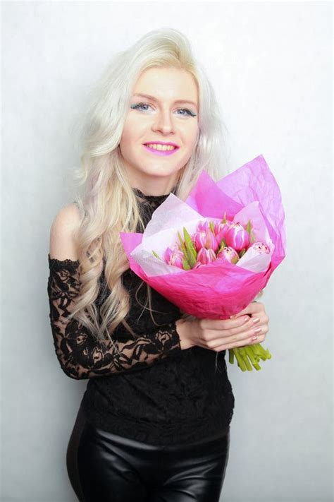 Tender Pretty Blonde Slim Teen Girl With Pink Flowers Cheerful Woman With Fresh Bouquet Stock