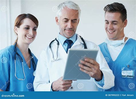 Tablet Meeting And Doctor With Nurses In Hospital For Medical Diagnosis Or Treatment Discussion