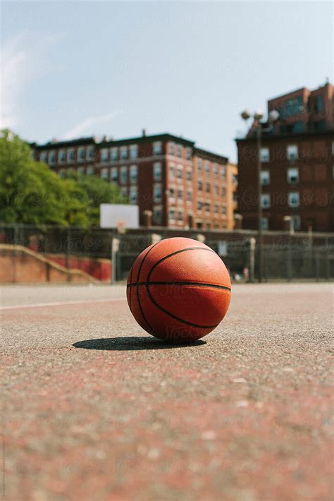 Urban Basketball Court In Boston With Single Ball By Stocksy