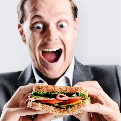 Comical Man Eating Sandwich With Funny Expression Stock Photo Image