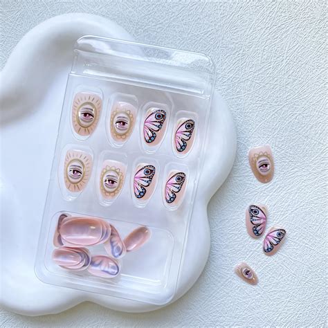 Uñas postizas a presión de almendra uñas postizas cortas color rosa nude diseño de mariposa y