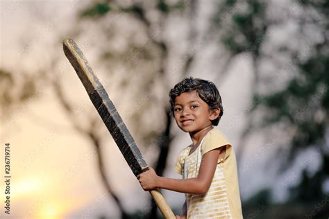 indian girl child playing cricket Stock Photo | Adobe Stock