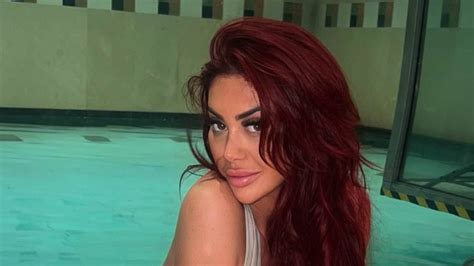 Chloe Ferry Puts On A Very Busty Display In A Tiny Nude Bikini As She Relaxes By Her Swanky