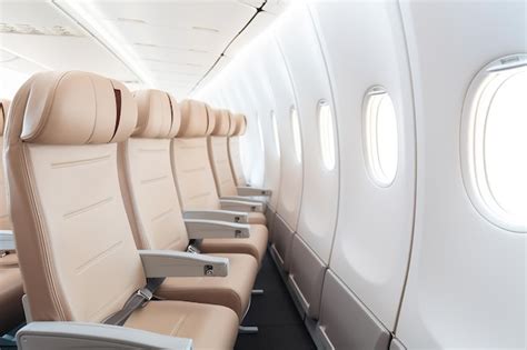 Premium Photo | Individual Aisle Seat on a Plane Comfortable Travel Experience