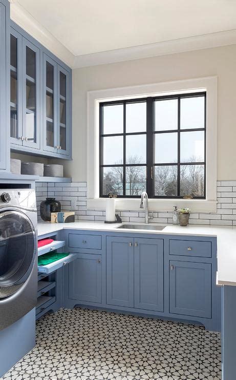 Blue Laundry Cabinets With Black And White Mosaic Cement Floor Tiles