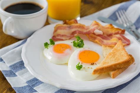 American Breakfast With Sunny Side Up Eggs Bacon Toast Pancakes