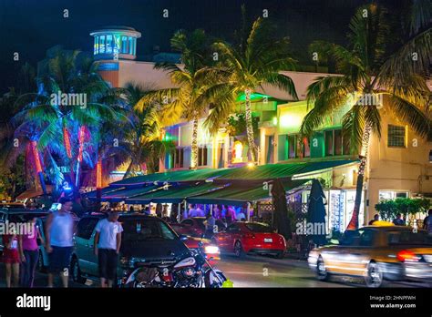 people enjoy nightlife at the colorful ocean drive by night Stock Photo ...