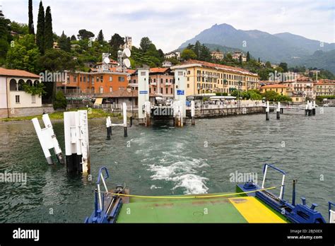 MENAGGIO, LAKE COMO - JUNE 2019: View of the dock as a ferry leaves the ...