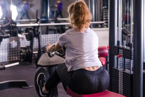 Fitness Caucasian Women Performing Doing Exercises Training With Rowing