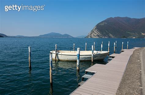 Isolated White Boat Moored At Monte Isola Iseo Lake Brescia Province