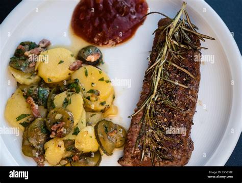 Rosemary lamb steaks with garlic Stock Photo - Alamy