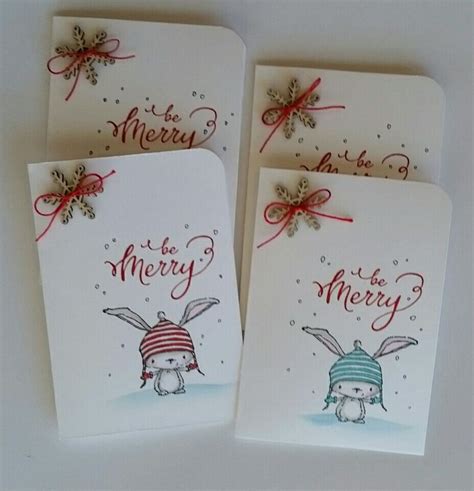 Three Christmas Cards With Two Rabbits Wearing Hats And Bows On Them