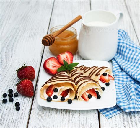 crepes with strawberries and chocolate sauce 5746134 Stock Photo at Vecteezy