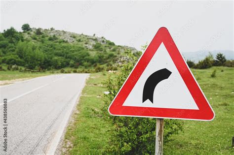 Title Road Sign In Countryside Dangerous Curve To The Right Traffic