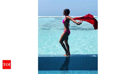Mandira Bedi Proves That Age Is Just A Number As She Poses In A Pink Bikini Hindi Movie News