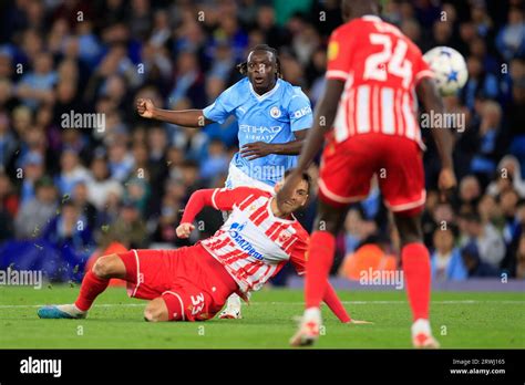 Jeremy Doku #11 of Manchester City crosses the ball during the UEFA ...