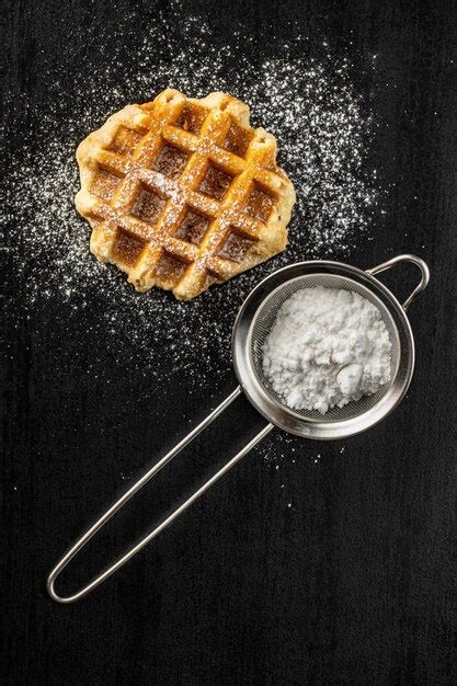 Premium Photo Belgian Waffles Sprinkled With Sugar On Black Table Top